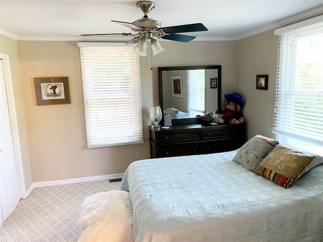 bedroom featuring carpet, ceiling fan, and ornamental molding