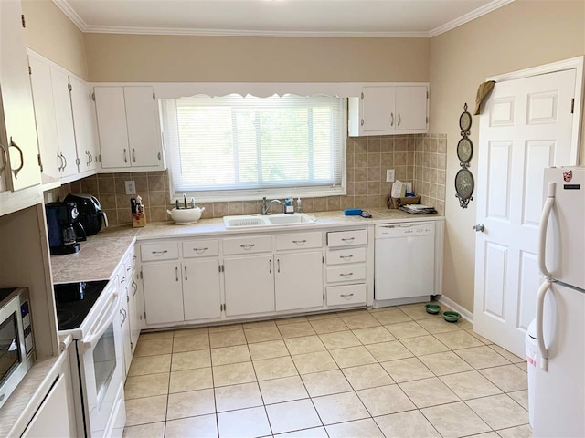 kitchen with white appliances, white cabinets, crown molding, sink, and tasteful backsplash