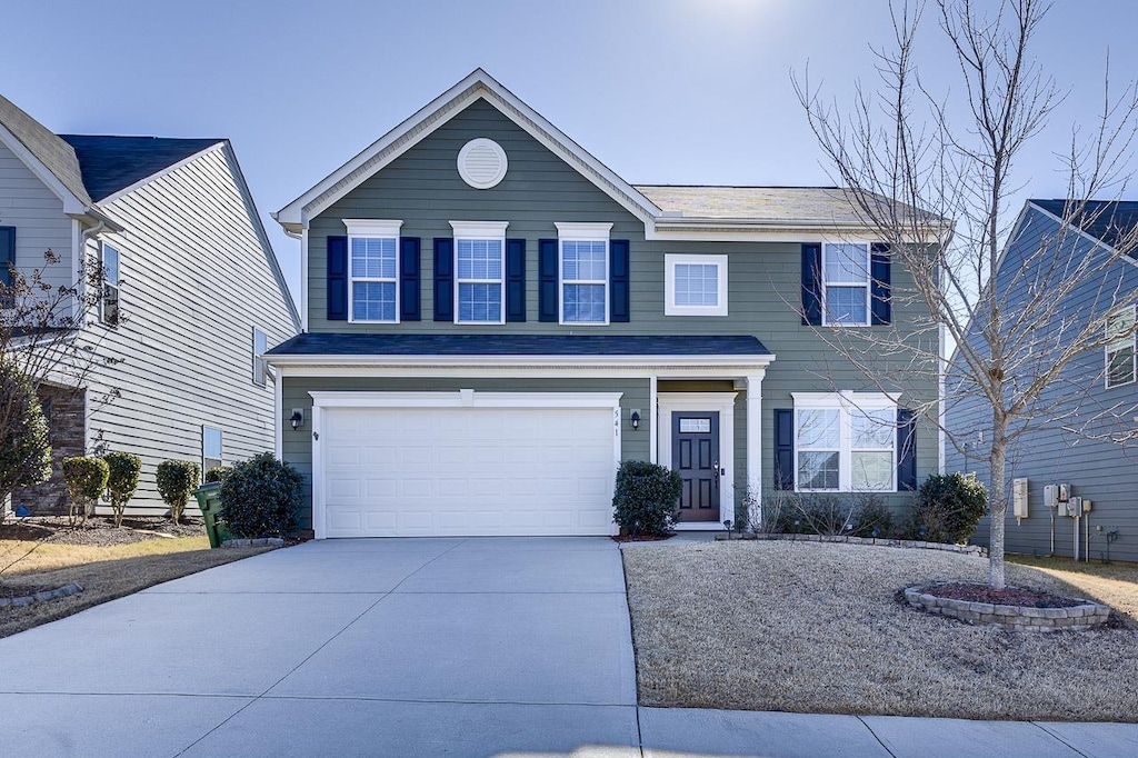 view of front of property with a garage