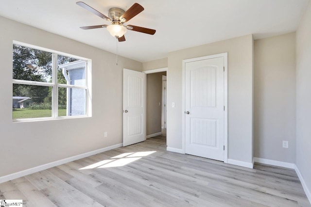 unfurnished bedroom with light wood-type flooring and ceiling fan