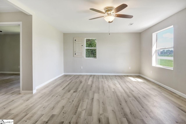 unfurnished room featuring light wood-type flooring and ceiling fan