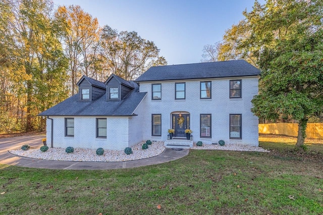 view of front of property with a front lawn