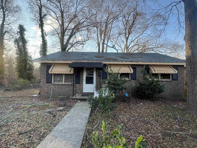 view of front of property featuring brick siding