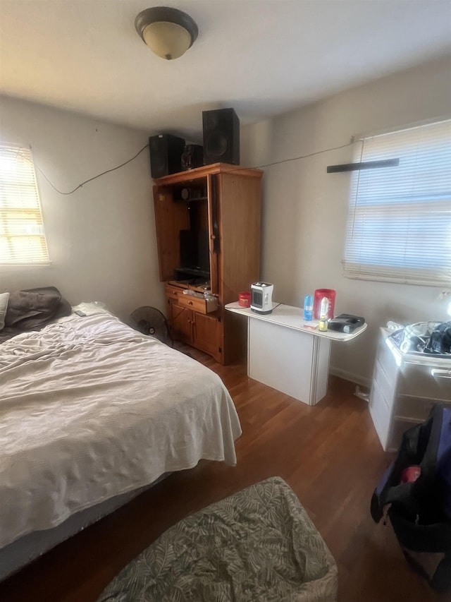 bedroom with wood finished floors