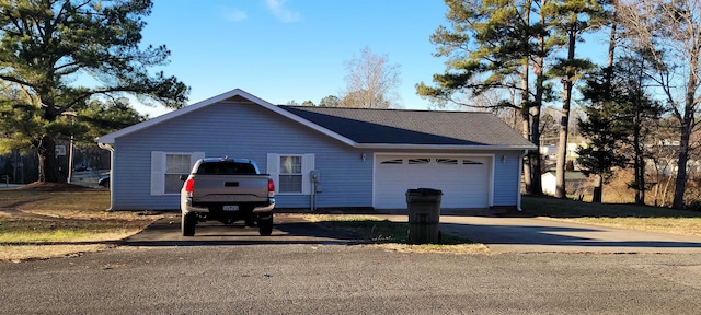 single story home with a garage