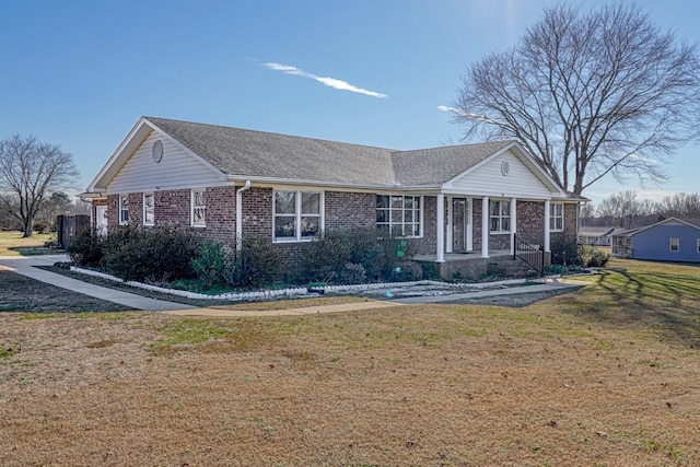 ranch-style home with a front lawn