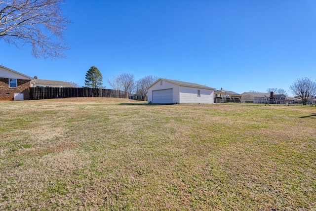 view of yard with a garage and an outdoor structure