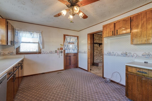 kitchen featuring a textured ceiling, dishwasher, ceiling fan, and crown molding