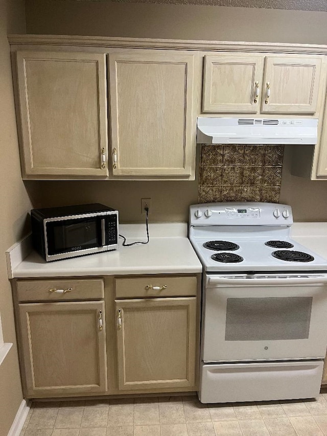 kitchen featuring electric range and light brown cabinets