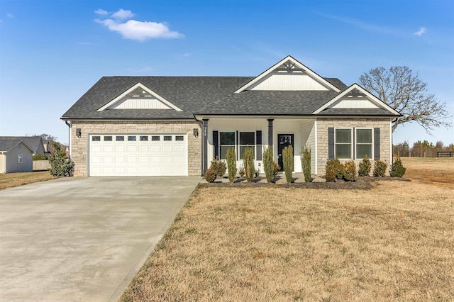 view of front of home with a garage and a front yard