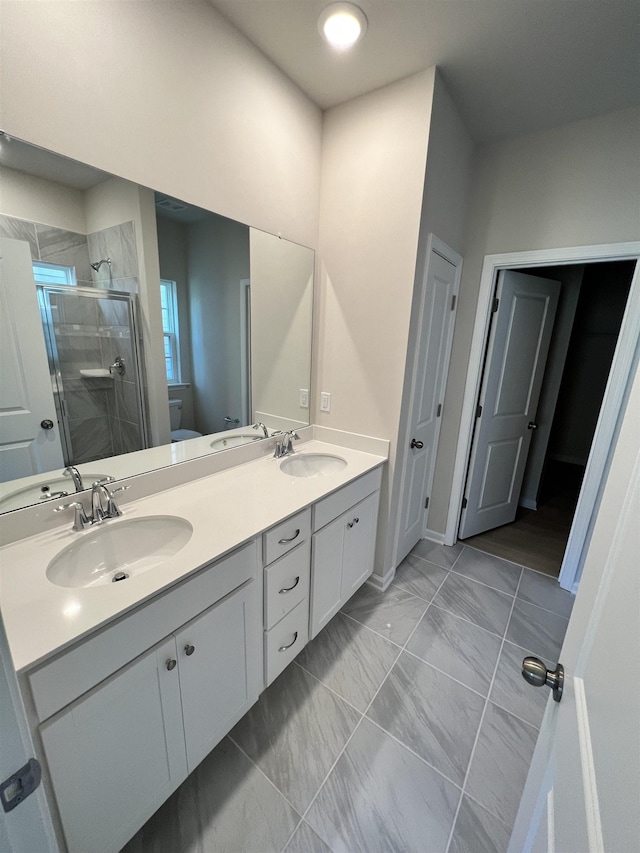 bathroom featuring vanity and walk in shower