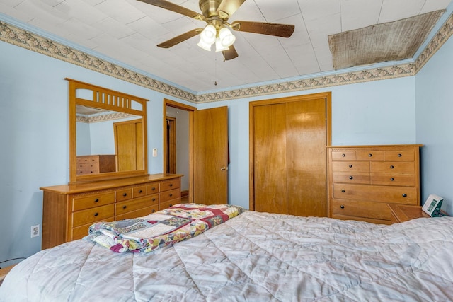 bedroom featuring ceiling fan and ornamental molding