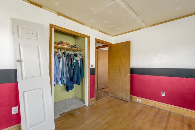 bedroom featuring a closet and wood-type flooring