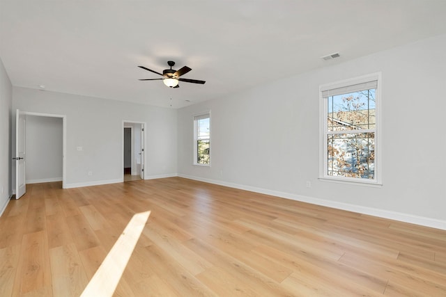 spare room featuring light wood-type flooring and ceiling fan