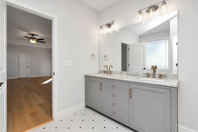 bathroom with ceiling fan and vanity