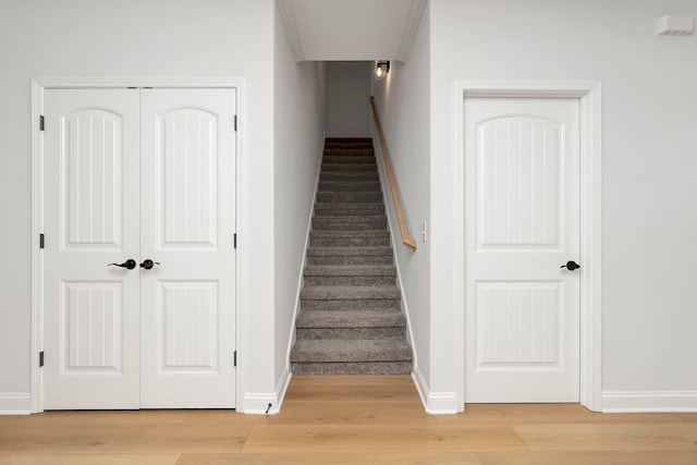 stairs featuring wood-type flooring