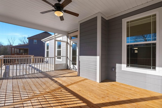 wooden terrace with ceiling fan