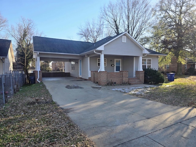 view of front of property with a porch and a carport