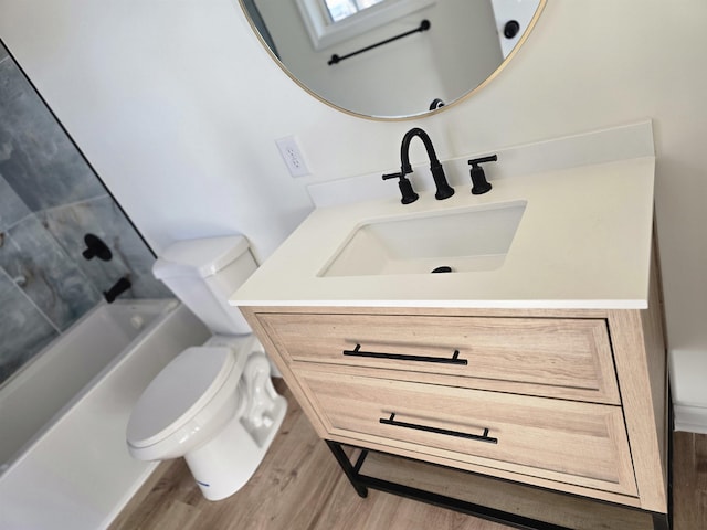 full bathroom with toilet, vanity, shower / tub combination, and wood-type flooring