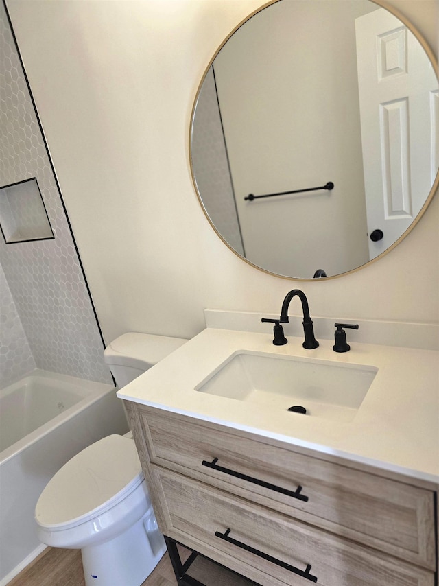 bathroom featuring toilet and vanity