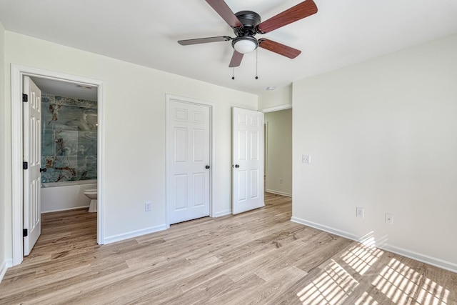 unfurnished bedroom with ceiling fan, light hardwood / wood-style flooring, and ensuite bathroom