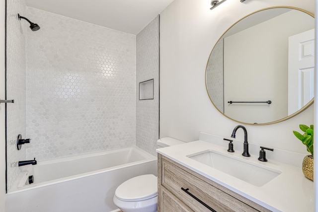 full bathroom with toilet, vanity, and tiled shower / bath combo