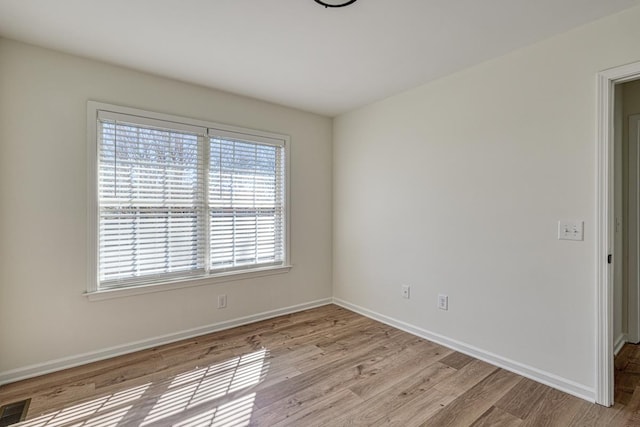 unfurnished room featuring light hardwood / wood-style floors