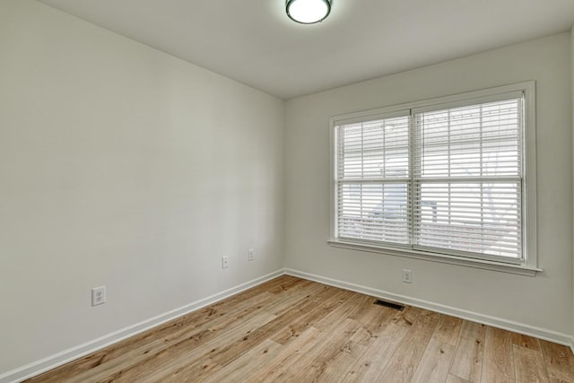 empty room featuring light hardwood / wood-style floors