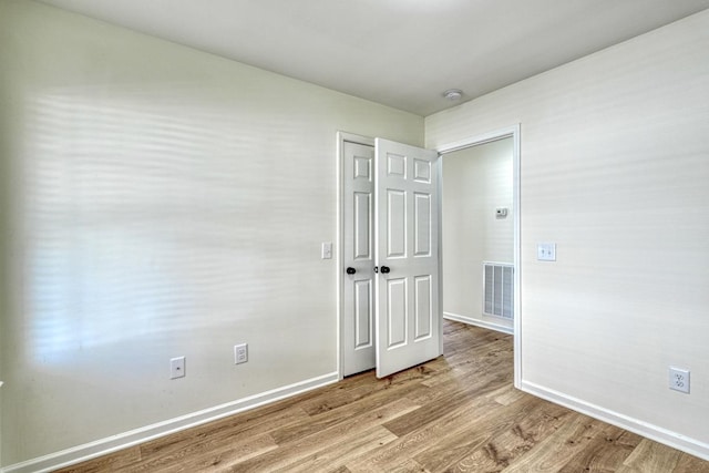 empty room featuring light hardwood / wood-style floors