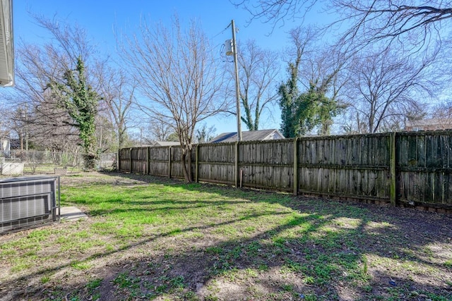 view of yard featuring central air condition unit