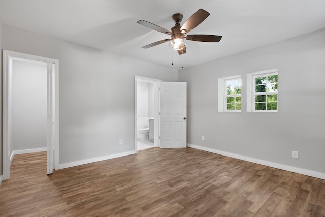 spare room featuring hardwood / wood-style flooring and ceiling fan