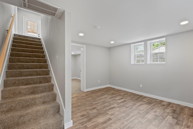 stairs with wood-type flooring