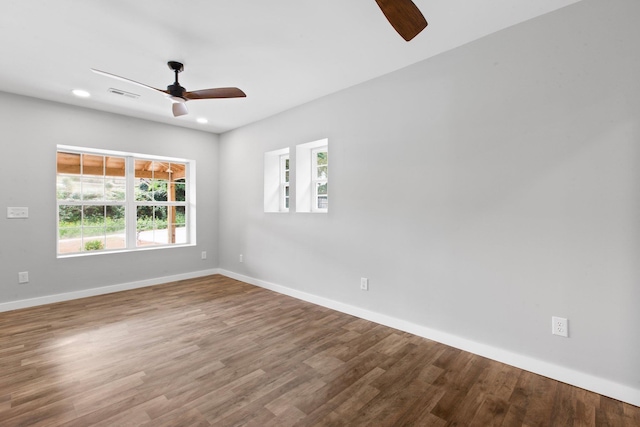 unfurnished room with wood-type flooring