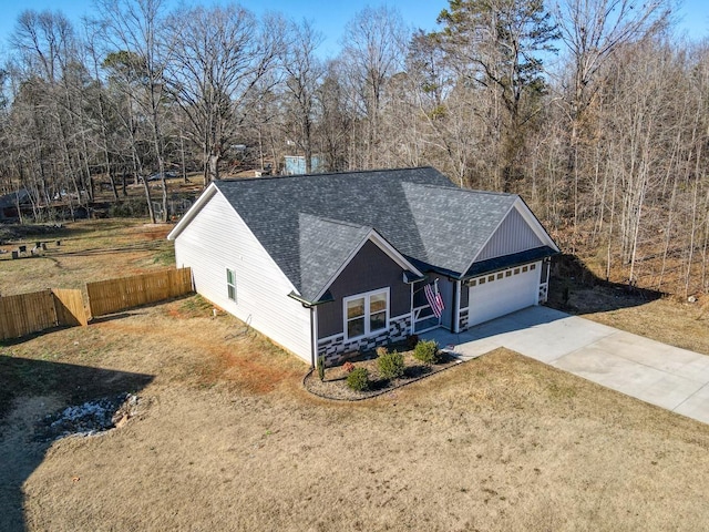 view of front facade with a front lawn and a garage