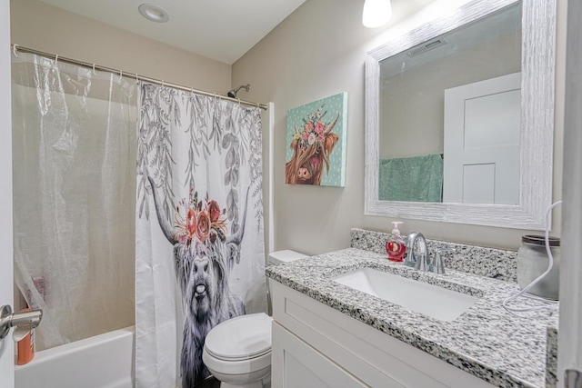 full bathroom with toilet, vanity, and shower / bath combo