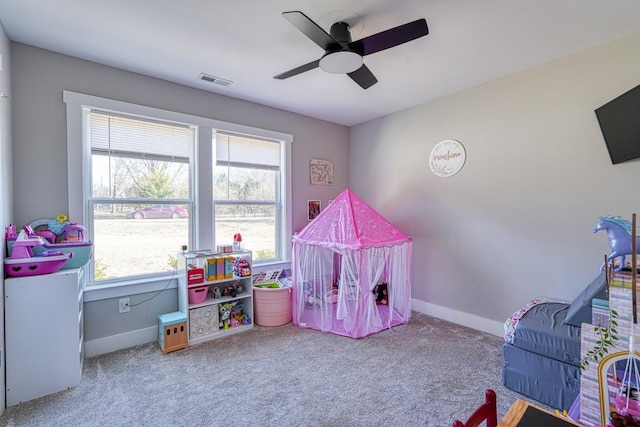 playroom featuring carpet, ceiling fan, and plenty of natural light