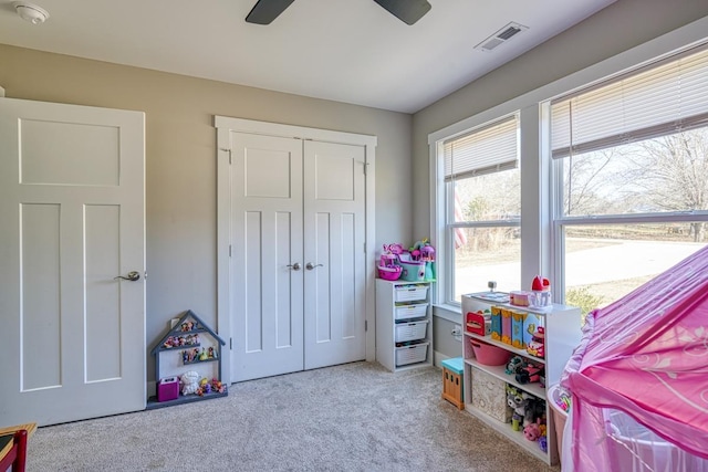 rec room featuring ceiling fan and carpet flooring