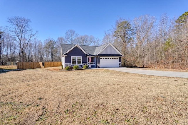 view of front facade with a front yard and a garage