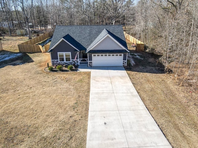 view of front of house with a front lawn and a garage