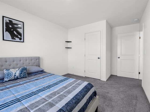 bedroom with dark colored carpet