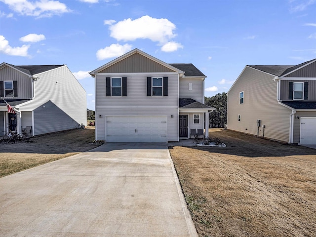 view of front property featuring a front yard and a garage