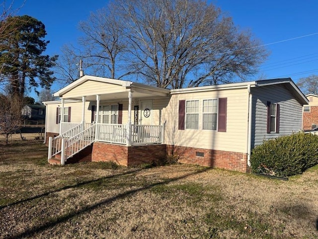 view of front facade with a porch and a front yard