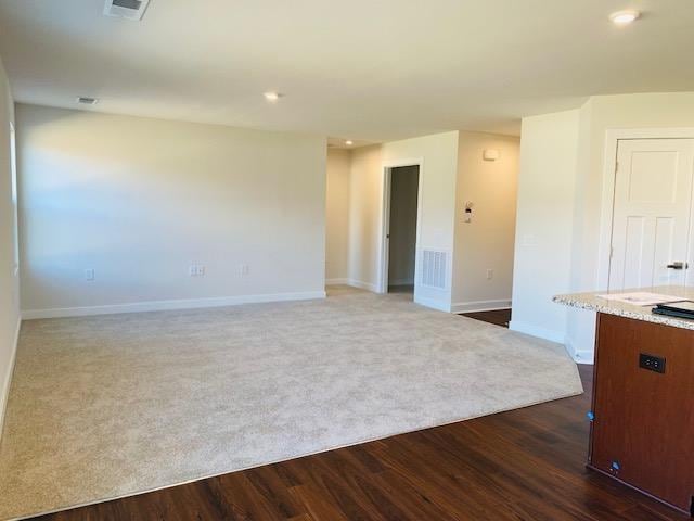 empty room featuring dark hardwood / wood-style floors