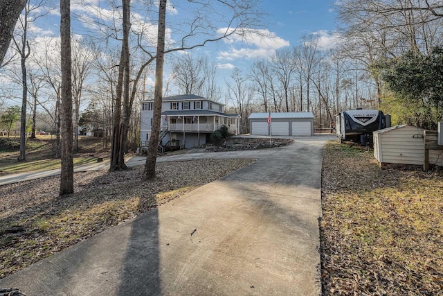 view of side of property with a garage and an outdoor structure