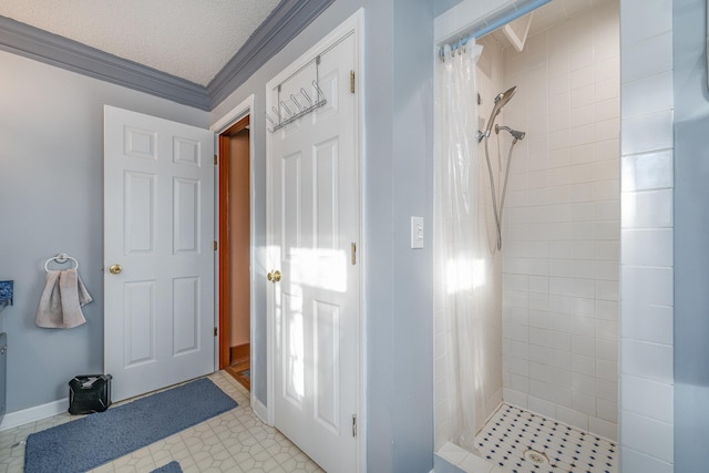 bathroom with a shower with shower curtain, a textured ceiling, and crown molding