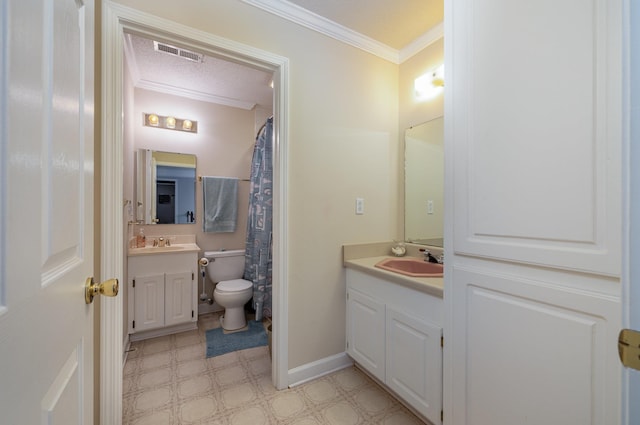 bathroom with vanity, a textured ceiling, and crown molding