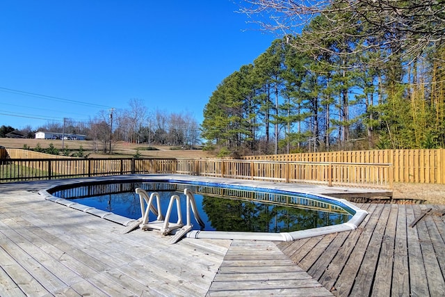 view of swimming pool featuring a deck