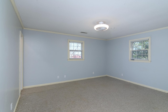 carpeted spare room with crown molding