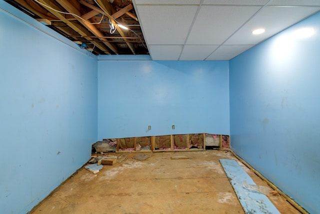 basement featuring a drop ceiling