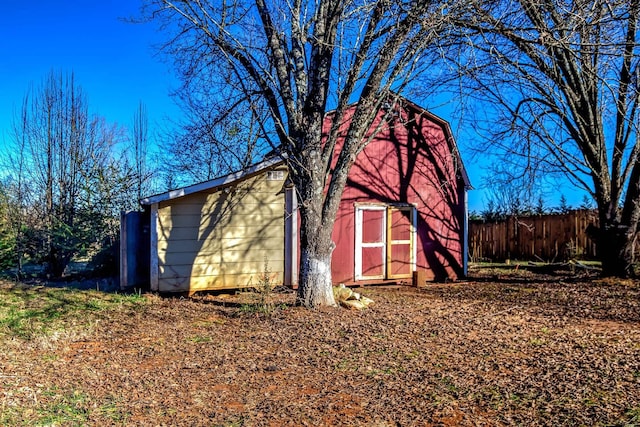 view of property exterior featuring a storage unit